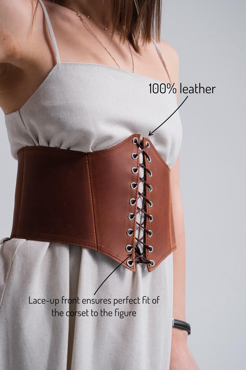a woman wearing a brown leather corset