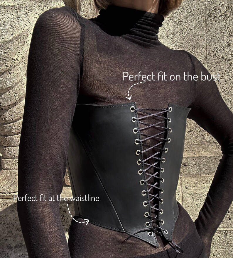a woman wearing a black corset with laces
