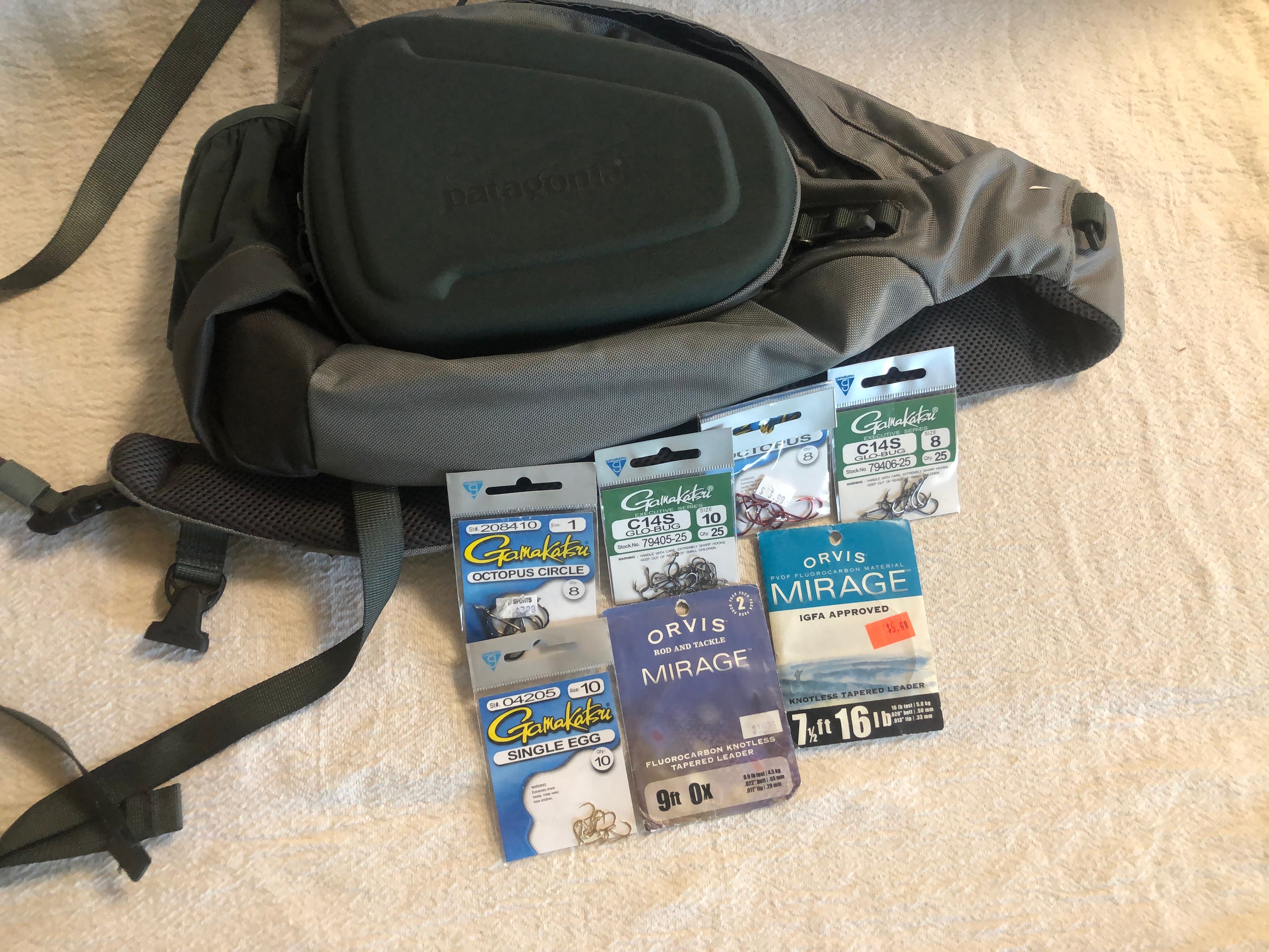 Patagonia Fly Fishing Stealth Atom Sling Pack with various packs of fishing  leads. Leads are New never opened.