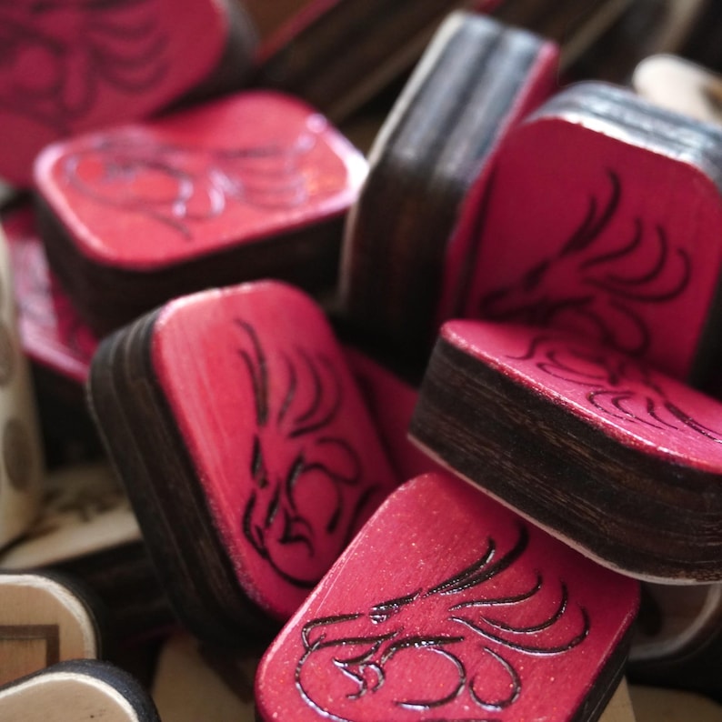 Close-up of handmade wooden Riichi Mahjong tiles with red glitter dragon design, ready to ship