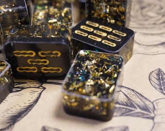 Tessere da Mahjong Riichi in resina formato viaggio - Nere con inchiostro dorato e dettagli in lamina glitterata