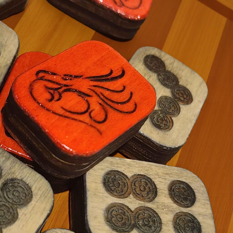 Close-up of handmade wooden Riichi Mahjong tiles with red glitter dragon design, ready to ship