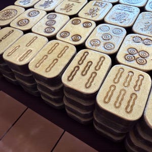 Handcrafted American Mahjong tiles featuring an adorable lazy panda on an aqua background with pink polka dots, engraved and hand-painted wooden tiles made from layered basswood with matching suit engravings on the front, ready to ship within one business day.
