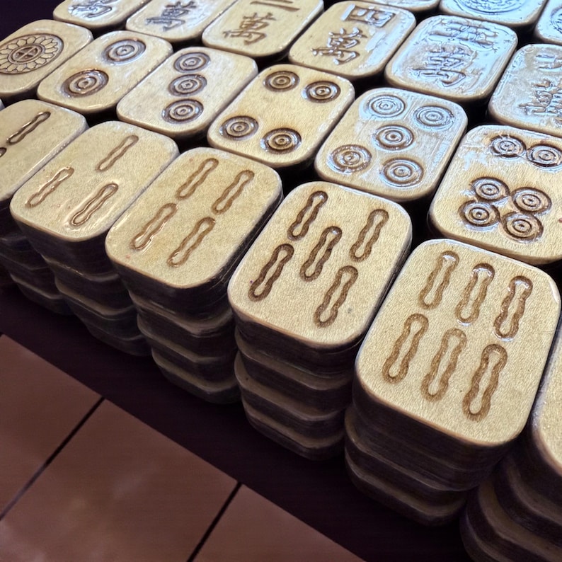 Handcrafted American Mahjong tiles featuring an adorable lazy panda on an aqua background with pink polka dots, engraved and hand-painted wooden tiles made from layered basswood with matching suit engravings on the front, ready to ship within one business day.