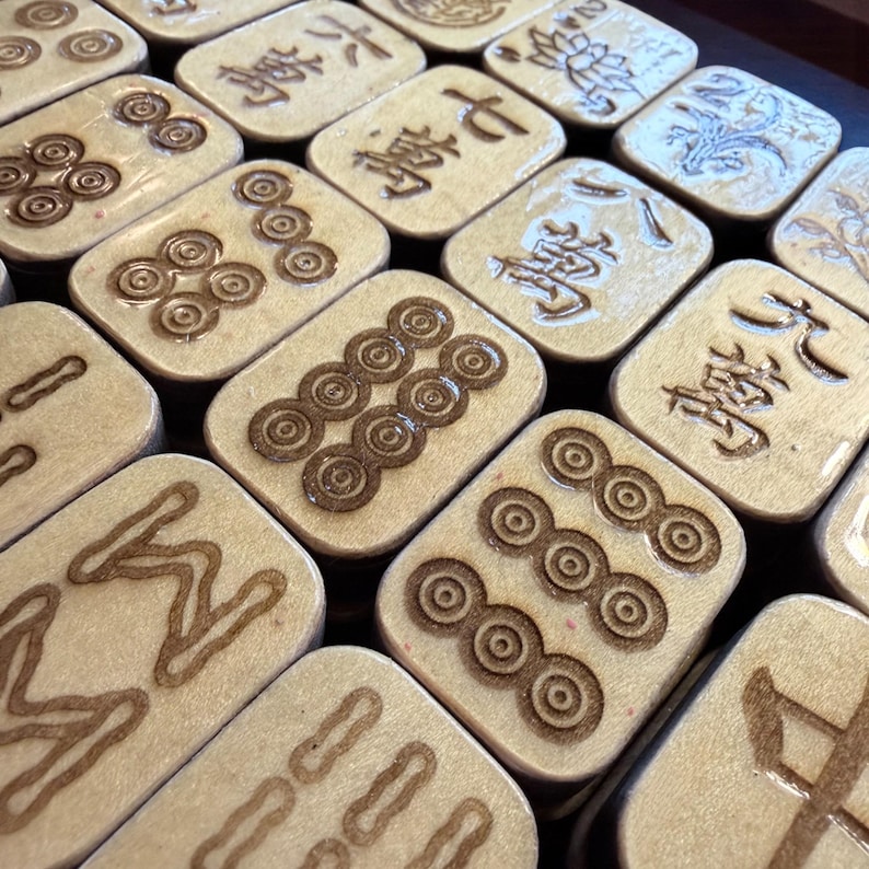 Handcrafted American Mahjong tiles featuring an adorable lazy panda on an aqua background with pink polka dots, engraved and hand-painted wooden tiles made from layered basswood with matching suit engravings on the front, ready to ship within one business day.