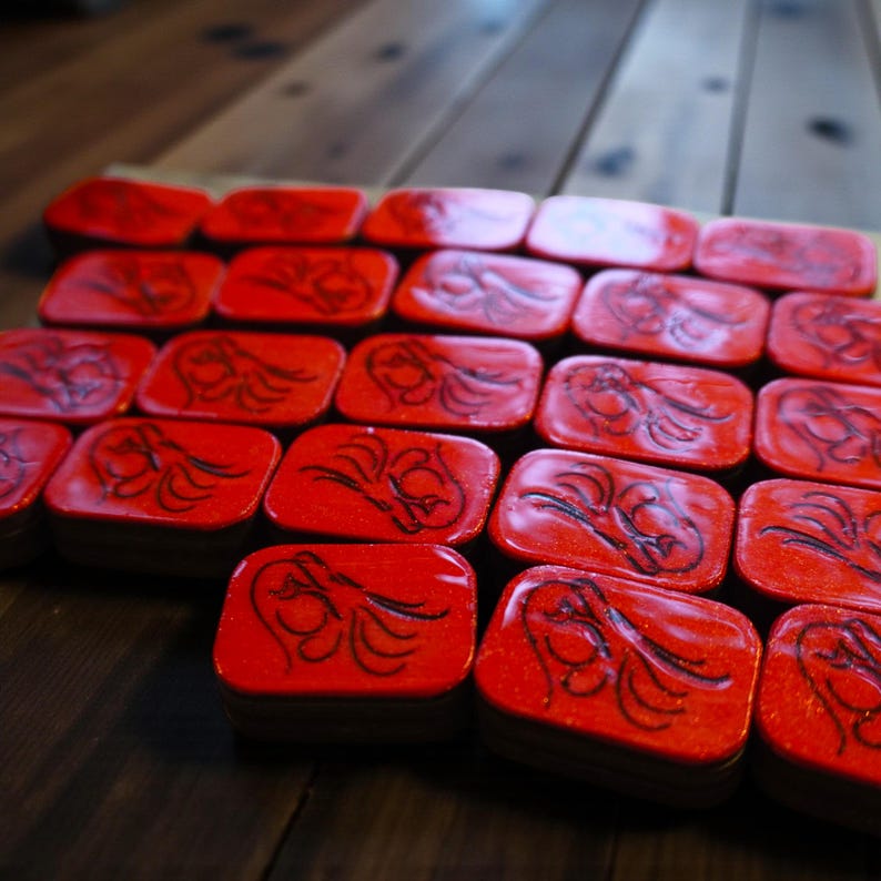 Close-up of handmade wooden Riichi Mahjong tiles with red glitter dragon design, ready to ship