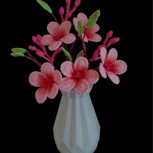 簡単なかぎ針編みの桜の花のパターン PDF | 無料ビデオチュートリアル付きの DIY かぎ針編みの花飾り | 手頃なステップバイステップガイド