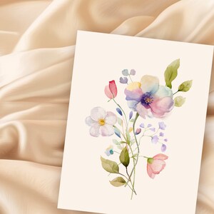 May include: A watercolor painting of a bouquet of flowers with pink, white, and purple blooms. The flowers are arranged in a loose, natural style, and the background is a soft, white.
