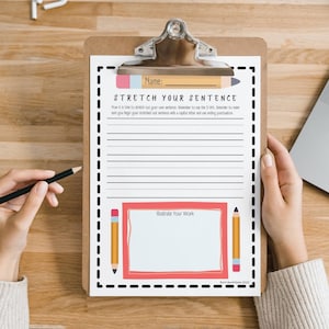 May include: A printable worksheet with a black and white dashed border. The worksheet is titled "Stretch Your Sentence" and has lines for writing. The worksheet also has a section for illustrating work.