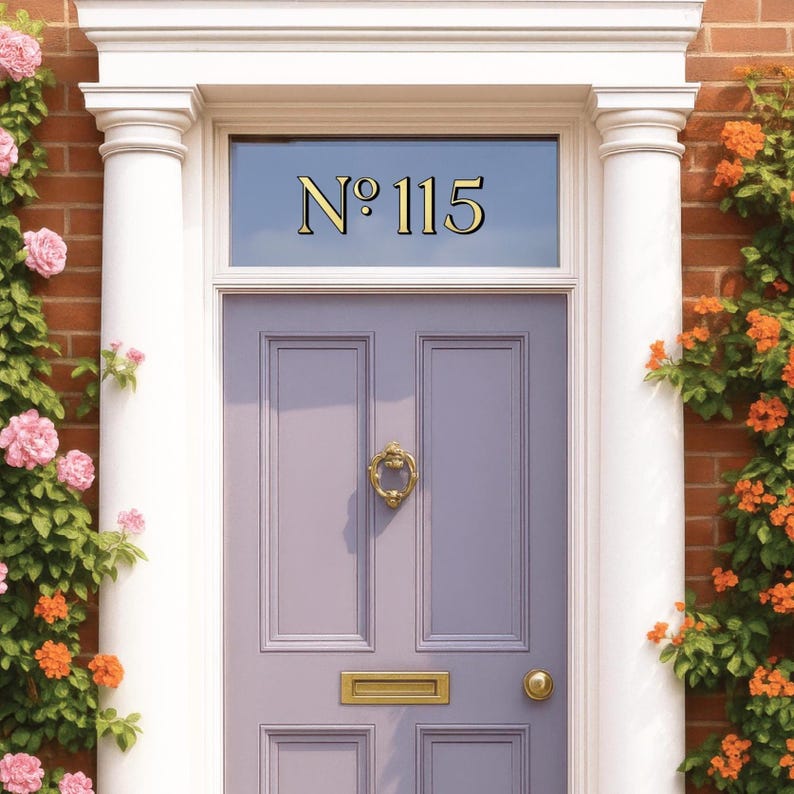 May include: A lavender front door with gold hardware and the number "No 115" above. The door is framed by white columns and a brick wall, with climbing plants and flowers on either side.