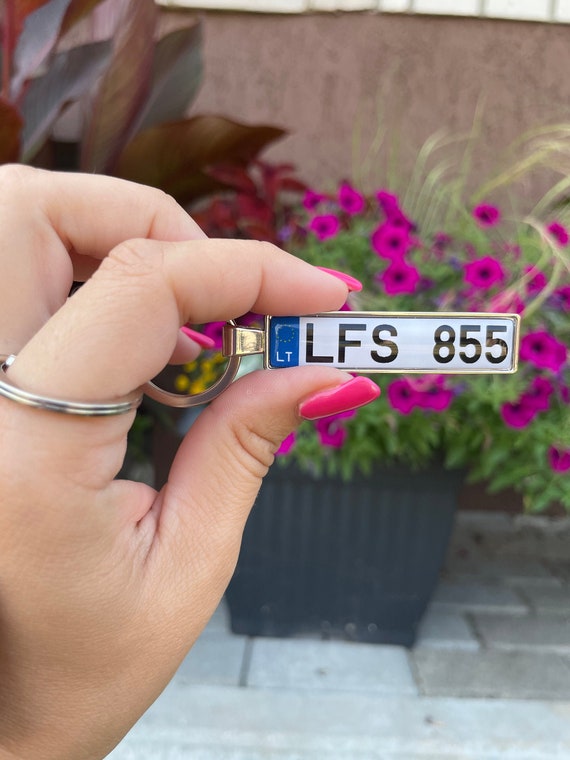 Registration store plate keyring