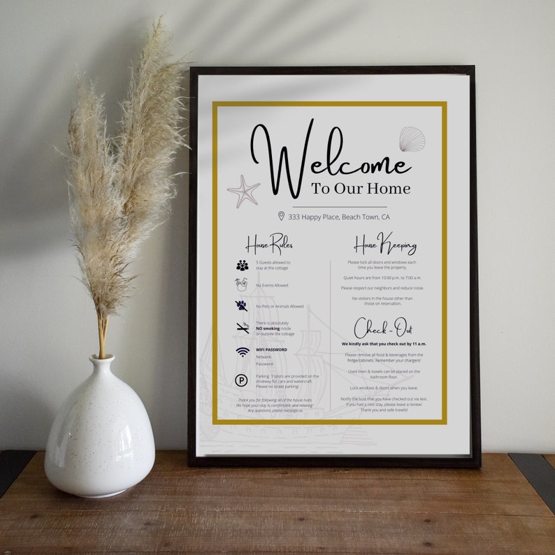 May include: A white framed welcome sign with gold accents and a nautical theme. The sign includes house rules and house keeping information for guests. The text on the sign reads "Welcome to Our Home", "333 Happy Place, Beach Town, CA", "House Rules", "House Keeping", and "Check-Out".