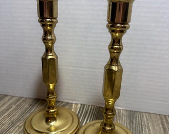 Pair of brass Baldwin candle stick holders round base 7” tall