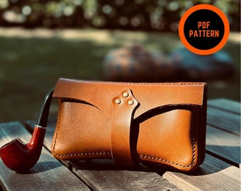 May include: A brown leather pipe case with a strap and a red pipe. The case is sitting on a wooden surface. The text "PDF PATTERN" is in a red circle on the image. The text "THERE IS NO VIDEOS FOR THIS PATTERN" is at the bottom of the image.