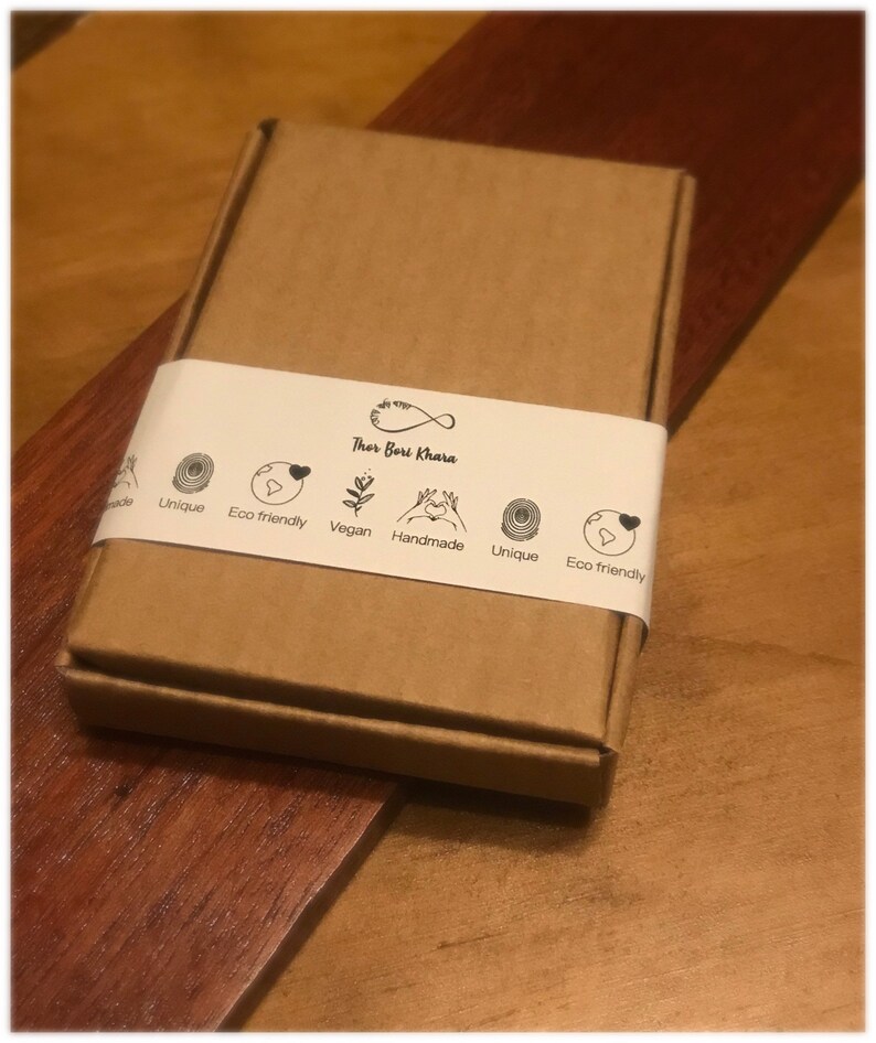 May include: A brown cardboard box with a white label that says "Thor Bari Khara" and has icons for unique, eco-friendly, vegan, handmade, and eco-friendly.