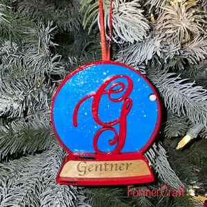 Custom monogram snow globe Christmas ornament with family name