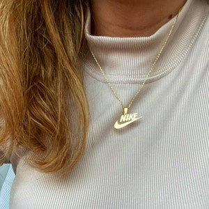 Gold stainless steel delicate 22” chain Necklace with nike swoosh logo  pendant