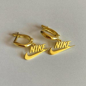 Nike swoosh hotsell earrings gold