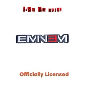May include: Embroidered patch featuring the name "EMINEM" in navy blue and white lettering with a red "3". The text "iron on patch" is above the patch, and "Officially Licensed" is below.