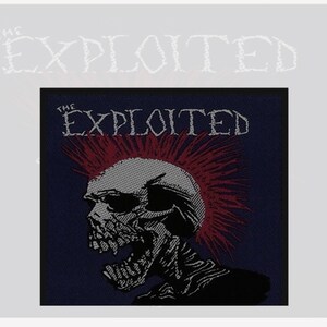 May include: A blue and red embroidered patch with a skull with a mohawk and the text "The Exploited".