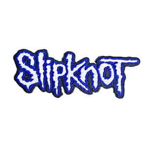 May include: An embroidered fabric patch featuring the word Slipknot in a stylised, jagged white font with a bold blue outline and a black border. The lettering has a distressed, sharp appearance, and the entire design is set against a plain white background.
