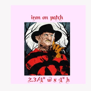 May include: Iron-on patch featuring a red and black illustration of Freddy Krueger, a horror movie character, with a knife. The text "iron on patch" and "2 3/4" w x 8 4" h" is included in the image.