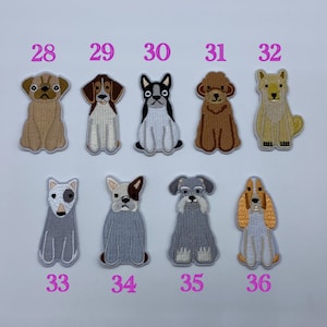 May include: Ten embroidered iron-on patches featuring different dog breeds. The patches are in various colours, including brown, white, black, and grey. The patches are numbered 28 through 36.