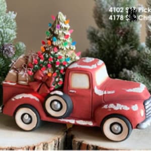 May include: A red ceramic pickup truck with a Christmas tree, gifts, and a bow in the truck bed. The truck has white accents and black tires. The text on the image reads "4102 Pickup" and "4178 Christmas".