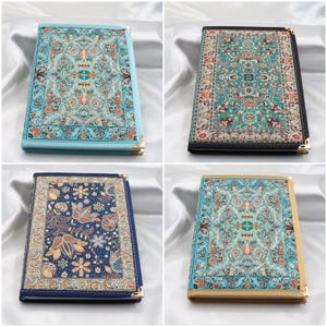 May include: Four different patterned notebooks with gold trim. The covers feature a blue, black, and gold patterned design.