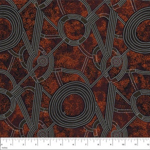 May include: A brown fabric with a repeating pattern of black and white circles and lines. The fabric has a speckled texture.