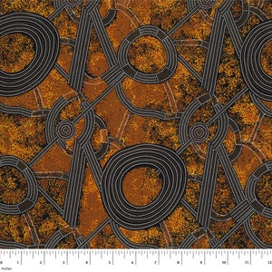 May include: Abstract pattern fabric with a brown background and black and white concentric circles and lines. The fabric has a speckled texture.