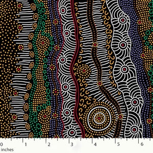 May include: A black fabric with a colorful Aboriginal dot painting design. The pattern includes white, red, yellow, green, and purple dots and lines. The image includes a ruler with inches.