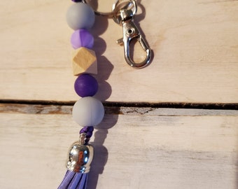 Silicone and wood beaded keychain with suede tassel