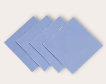May include: Four blue thermal pads, used for heat dissipation in electronics.