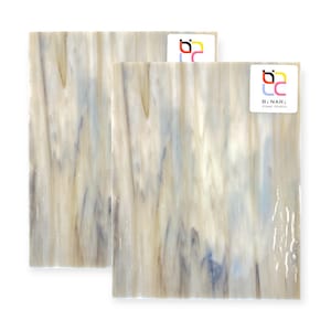 May include: Two rectangular glass sheets with a flowing pattern of white, beige, and blue. The glass has a translucent quality, with the colors blending together in vertical streaks. Each sheet has a sticker with the text "BINARI Glass Studio".