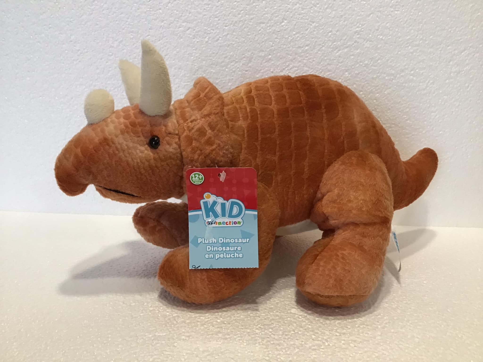 Orange triceratops best sale plush