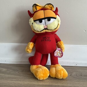 May include: A set of three ceramic mugs with a speckled, matte finish. The mugs are in shades of cream, light gray, and dark gray. Each mug has a simple, minimalist design, perfect for coffee or tea.