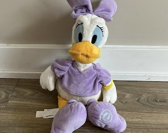 Pelúcia autêntica da Margarida da Disney Store, 40 cm, com laço roxo.