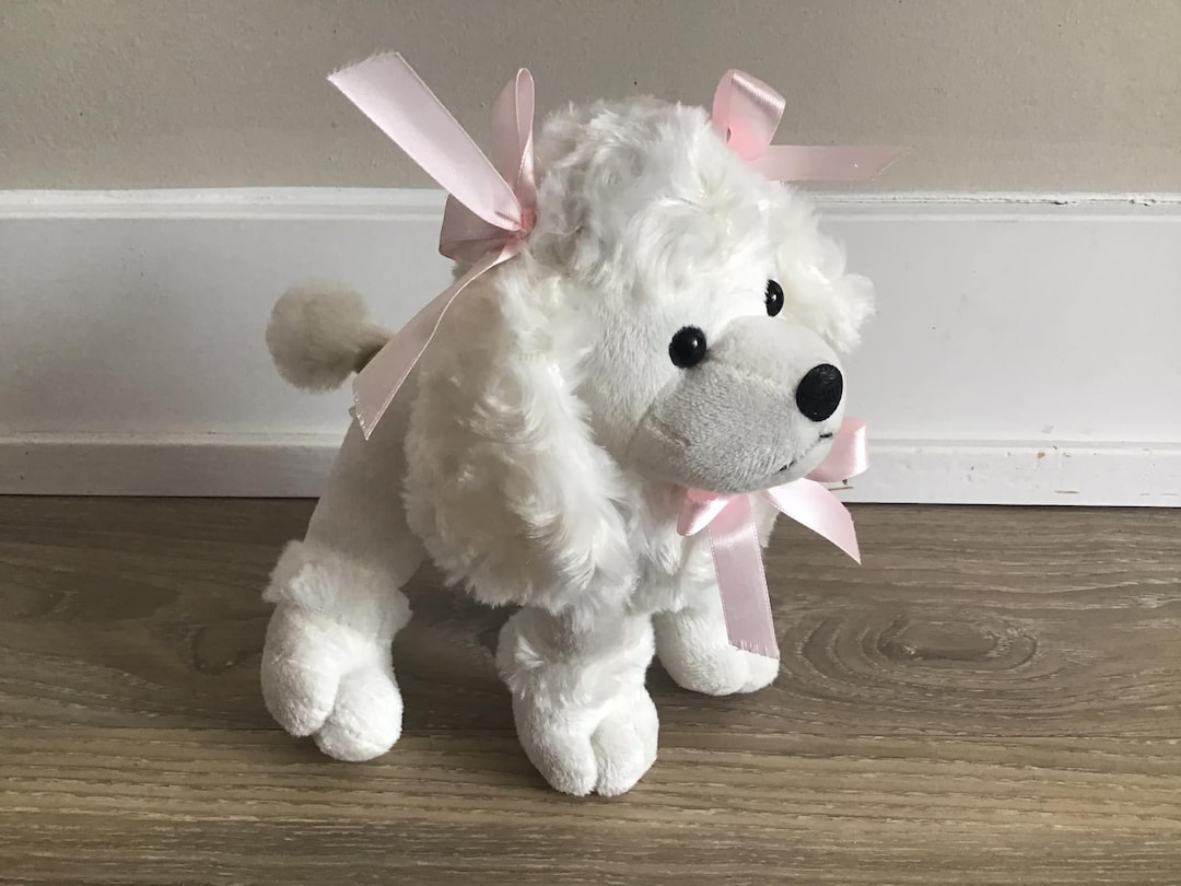 Peluche di cane di peluche di Barboncino bianco con fiocco rosa da