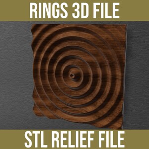 May include: A square wooden panel featuring a concentric circular ripple pattern carved in relief. The text RINGS 3D FILE is displayed at the top and STL RELIEF FILE is at the bottom against a dark background, representing a digital design.