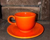 1969- 1973 Mango Red, Ironstone Fiesta tea-cup and saucer set.