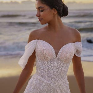 Fairytale Wedding Dress – Off Shoulder Bridal Gown with Beaded Corset & Flowing Tulle Skirt