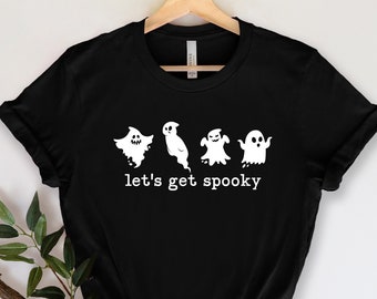 May include: Black t-shirt with a white graphic of four ghosts and the text "let's get spooky".