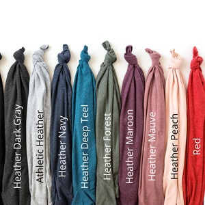 May include: A selection of ten t-shirts in various colors, including black, dark gray, heather gray, navy, teal, forest green, maroon, mauve, peach, red, and white.
