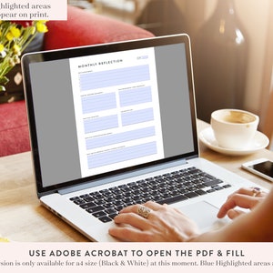 Peut inclure: Un ordinateur portable affichant une feuille de travail de r&eacute;flexion mensuelle imprimable. La feuille de travail comporte des sections pour les objectifs, les r&eacute;alisations, les d&eacute;fis et les le&ccedil;ons apprises. Le texte "UTILISER ADOBE ACROBAT POUR OUVRIR LE PDF ET REMPLIR" est affich&eacute; sous la feuille de travail.