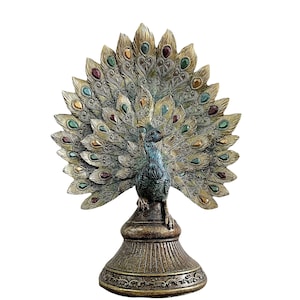 Sculpture of peacock on pedestal