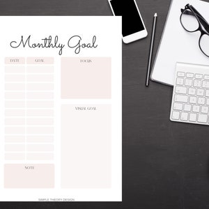 Pode incluir: Um planejador de objetivos mensal imprim&iacute;vel com se&ccedil;&otilde;es para data, objetivo, foco, objetivo visual e notas. O planejador tem um design simples com texto preto em fundo branco.