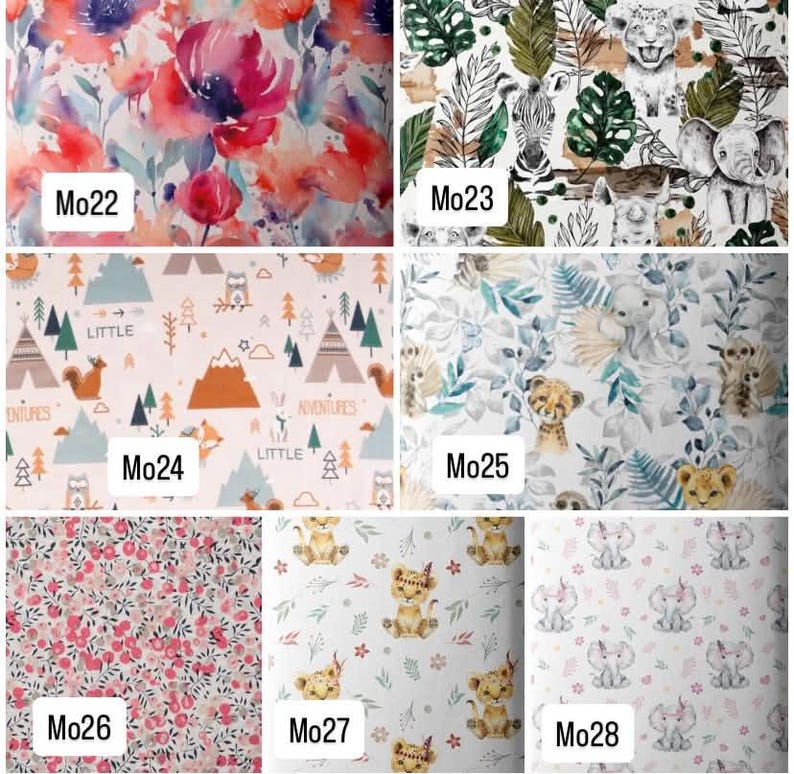 Op de afbeelding: Een raster van zeven stofstalen gelabeld van Mo22 tot Mo28. Patronen omvatten aquarelbloemen, jungledieren, bosavontuurmotieven, tropische bladeren, kleine rode bessen, cartoon leeuwenwelpjes en babyolifantjes met roze strikjes.