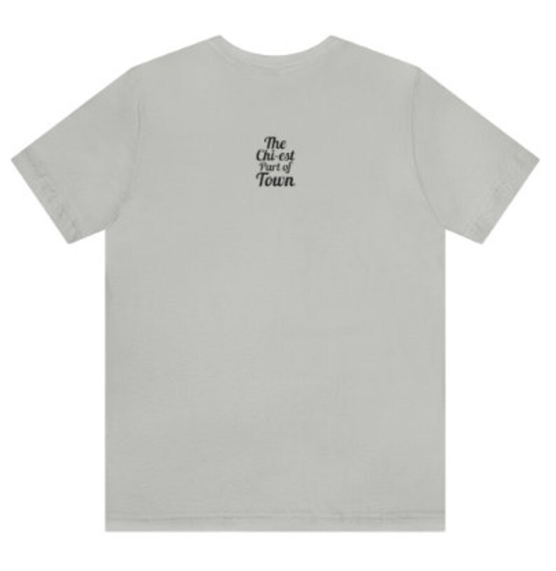 May include: A light grey t-shirt with the text "The Chi-est Part of Town" printed on the back.