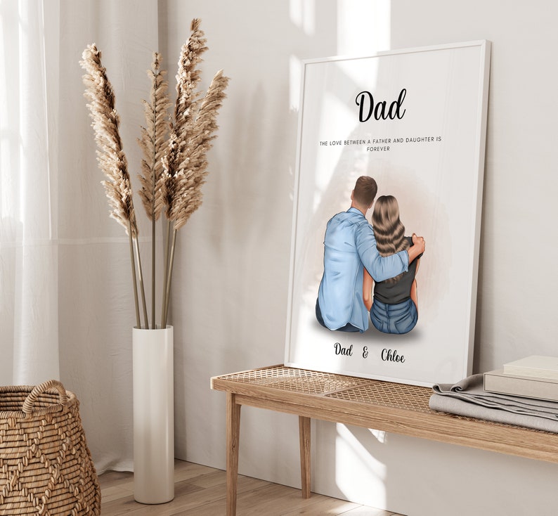 May include: A white framed print with a watercolor illustration of a father and daughter sitting back to back. The text reads "Dad, The love between a father and daughter is forever, Dad & Chloe".
